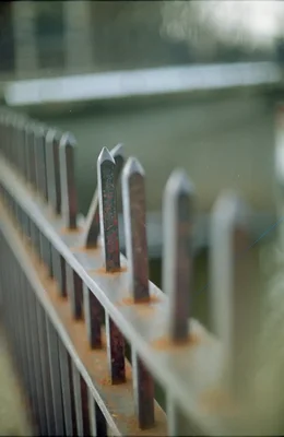 metal fence spikes with rust and wear